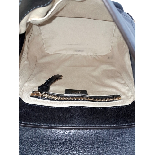 16 - A Chloe Faye Medium Backpack in Black and Suede. Black leather and suede exterior with gold-toned ha... 