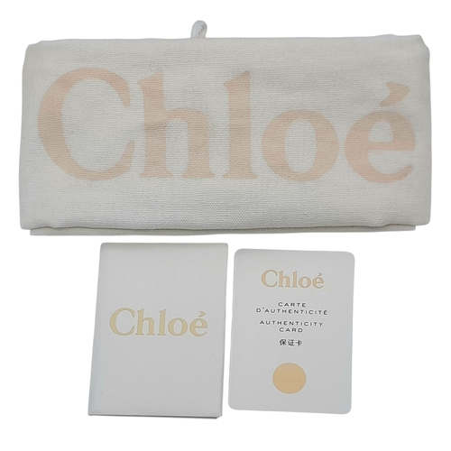 16 - A Chloe Faye Medium Backpack in Black and Suede. Black leather and suede exterior with gold-toned ha... 