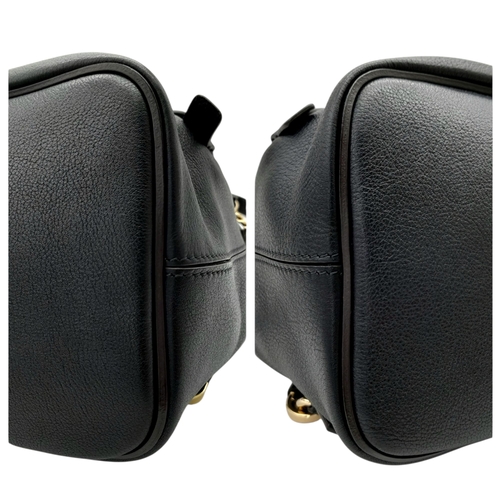 16 - A Chloe Faye Medium Backpack in Black and Suede. Black leather and suede exterior with gold-toned ha... 