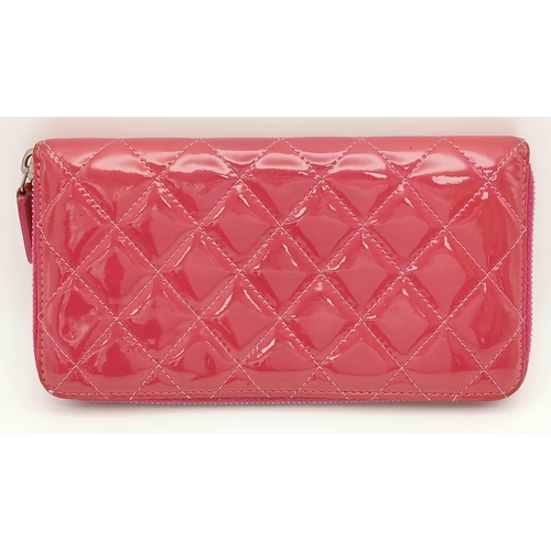 181 - A Chanel Pink Quilted Patent Leather Wallet. Pink quilted patent leather exterior with silver-tone h... 