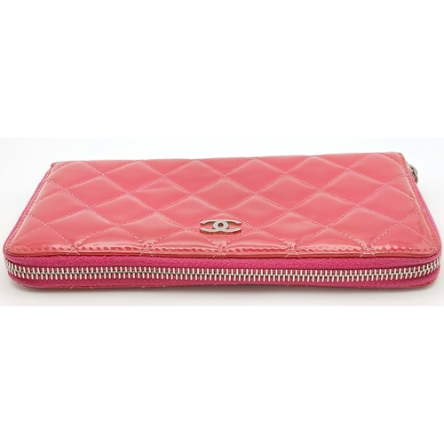 181 - A Chanel Pink Quilted Patent Leather Wallet. Pink quilted patent leather exterior with silver-tone h... 