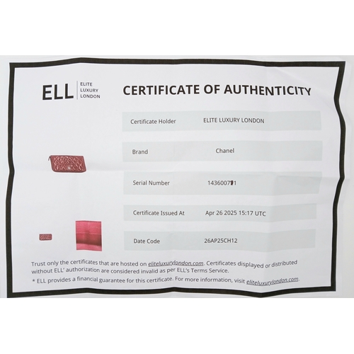 181 - A Chanel Pink Quilted Patent Leather Wallet. Pink quilted patent leather exterior with silver-tone h... 