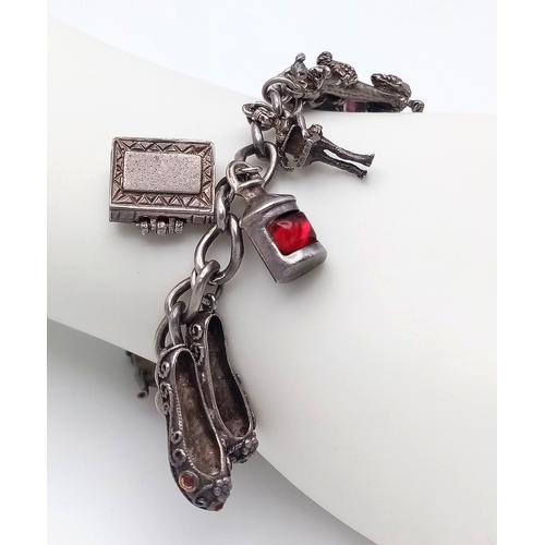 182 - Vintage SILVER CHARM BRACELET. Full UK hallmark with charms to include Lantern, Poodle, Wishing Well... 