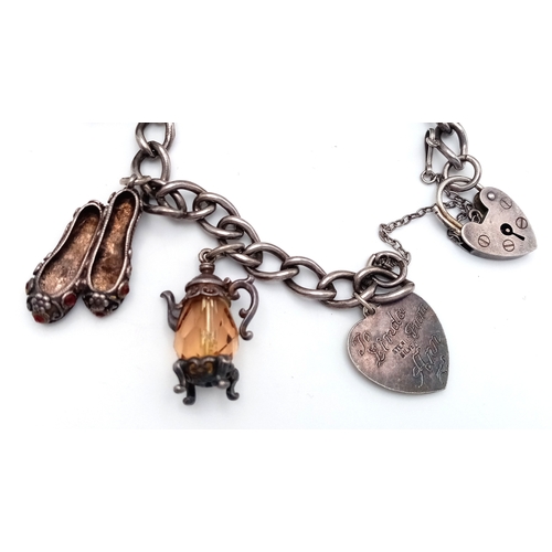 182 - Vintage SILVER CHARM BRACELET. Full UK hallmark with charms to include Lantern, Poodle, Wishing Well... 