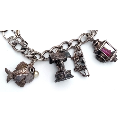 182 - Vintage SILVER CHARM BRACELET. Full UK hallmark with charms to include Lantern, Poodle, Wishing Well... 