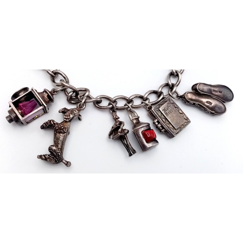 182 - Vintage SILVER CHARM BRACELET. Full UK hallmark with charms to include Lantern, Poodle, Wishing Well... 