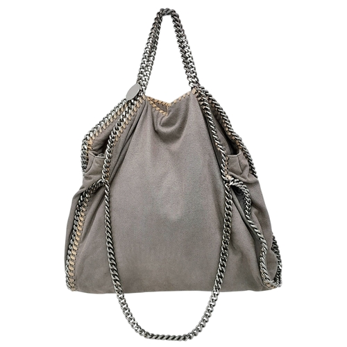 195 - A Stella McCartney Falabella Fold-Over Tote Bag. Grey faux suede exterior with silver-toned hardware... 