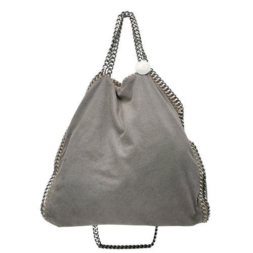 195 - A Stella McCartney Falabella Fold-Over Tote Bag. Grey faux suede exterior with silver-toned hardware... 