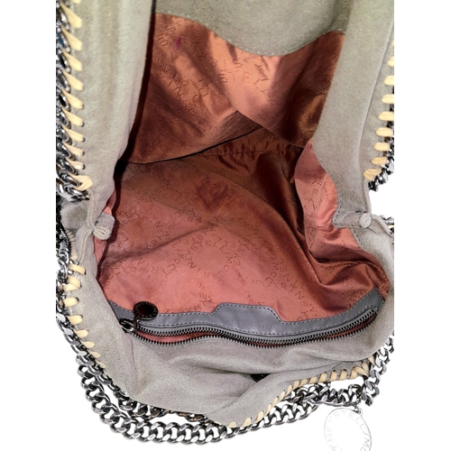 195 - A Stella McCartney Falabella Fold-Over Tote Bag. Grey faux suede exterior with silver-toned hardware... 