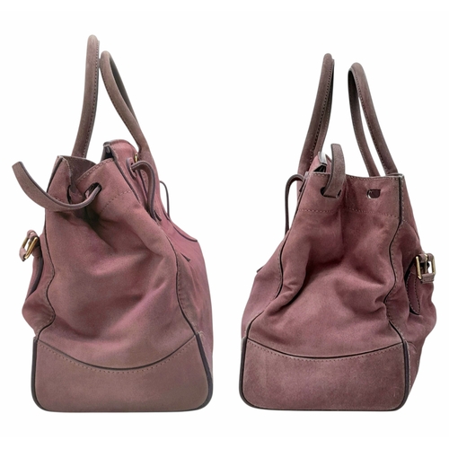 201 - A Ralph Lauren Pink Suede Tote Bag. Pink suede exterior with gold-toned hardware, rolled top handles... 