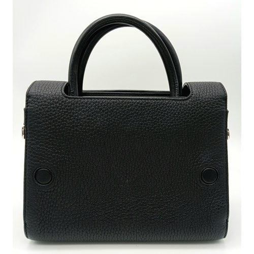 227 - A Christian Dior Black Diorever Handbag. Leather exterior with silver-toned hardware, two rolled lea... 