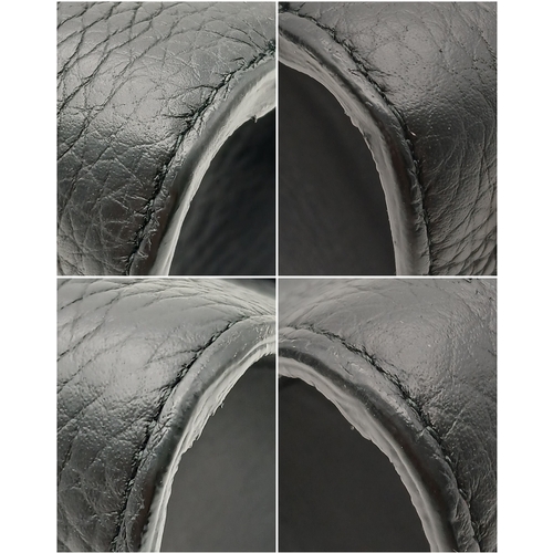 227 - A Christian Dior Black Diorever Handbag. Leather exterior with silver-toned hardware, two rolled lea... 