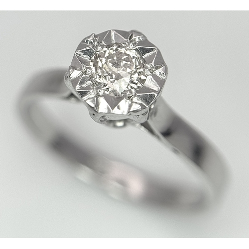 237 - An 18k White Gold Diamond Solitaire Ring. 0.30ct round brilliant cut diamond - Slightly champagne ti... 