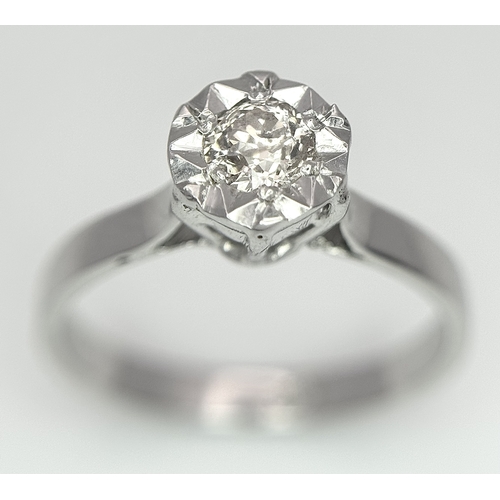 237 - An 18k White Gold Diamond Solitaire Ring. 0.30ct round brilliant cut diamond - Slightly champagne ti... 