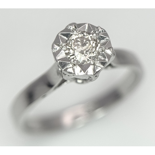 237 - An 18k White Gold Diamond Solitaire Ring. 0.30ct round brilliant cut diamond - Slightly champagne ti... 