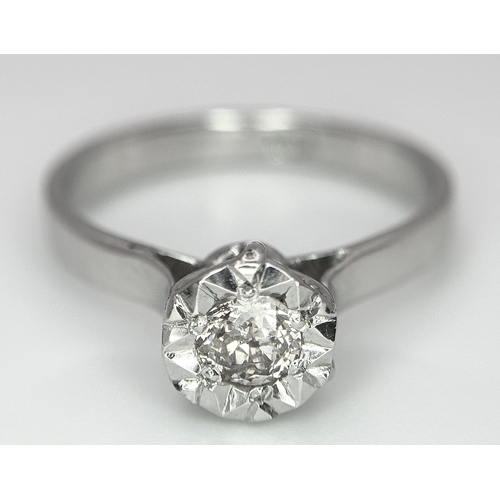 237 - An 18k White Gold Diamond Solitaire Ring. 0.30ct round brilliant cut diamond - Slightly champagne ti... 