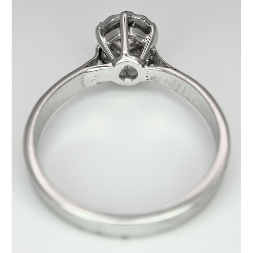 237 - An 18k White Gold Diamond Solitaire Ring. 0.30ct round brilliant cut diamond - Slightly champagne ti... 