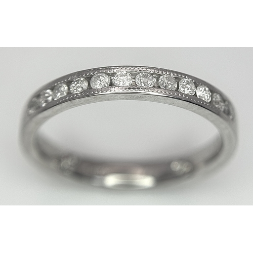 242 - AN 18K WHITE GOLD DIAMOND HALF ETERNITY RING WITH BEVELLED EDGES. 0.25CTW, 2.4G TOTAL WEIGHT. SIZE F... 