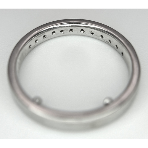 242 - AN 18K WHITE GOLD DIAMOND HALF ETERNITY RING WITH BEVELLED EDGES. 0.25CTW, 2.4G TOTAL WEIGHT. SIZE F... 