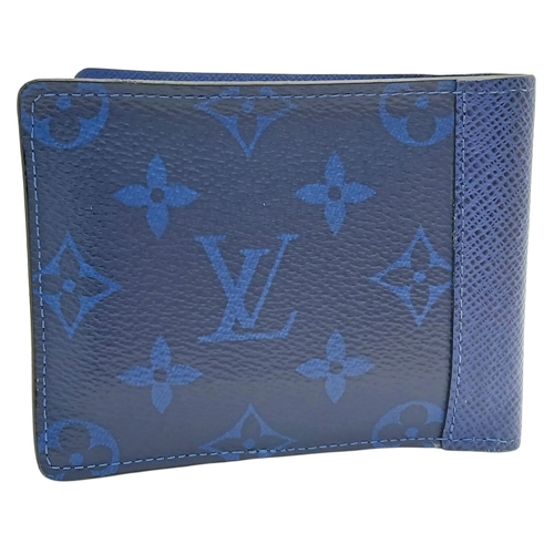243 - A Louis Vuitton Blue Monogram Eclipse Canvas Bifold Wallet. Blue monogram-printed coated canvas exte... 