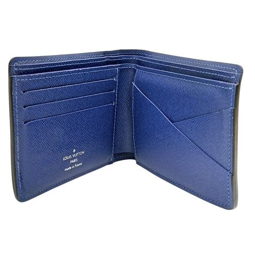 243 - A Louis Vuitton Blue Monogram Eclipse Canvas Bifold Wallet. Blue monogram-printed coated canvas exte... 