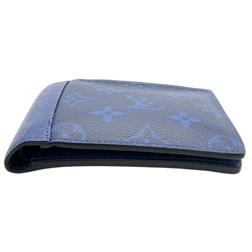 243 - A Louis Vuitton Blue Monogram Eclipse Canvas Bifold Wallet. Blue monogram-printed coated canvas exte... 