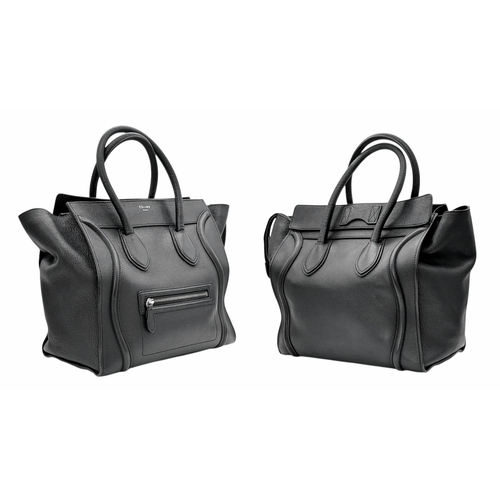 251 - A Céline Black Pebbled Leather Luggage Tote Bag. Black leather exterior with silver-toned hardware, ... 