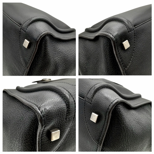 251 - A Céline Black Pebbled Leather Luggage Tote Bag. Black leather exterior with silver-toned hardware, ... 