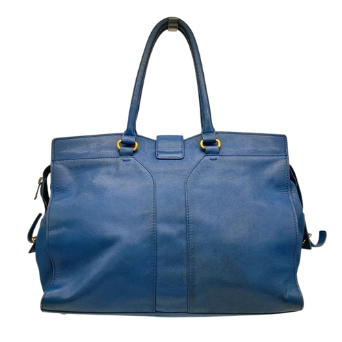 272 - A Yves Saint Laurent Cabas Chyc Tote Bag. Blue leather exterior with gold-toned hardware and zipped ... 