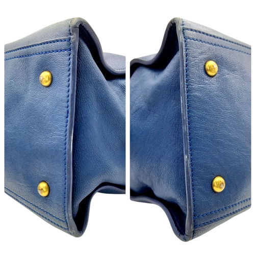 272 - A Yves Saint Laurent Cabas Chyc Tote Bag. Blue leather exterior with gold-toned hardware and zipped ... 