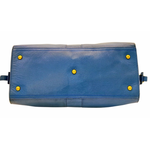 272 - A Yves Saint Laurent Cabas Chyc Tote Bag. Blue leather exterior with gold-toned hardware and zipped ... 