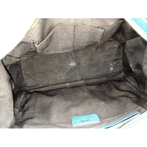 272 - A Yves Saint Laurent Cabas Chyc Tote Bag. Blue leather exterior with gold-toned hardware and zipped ... 