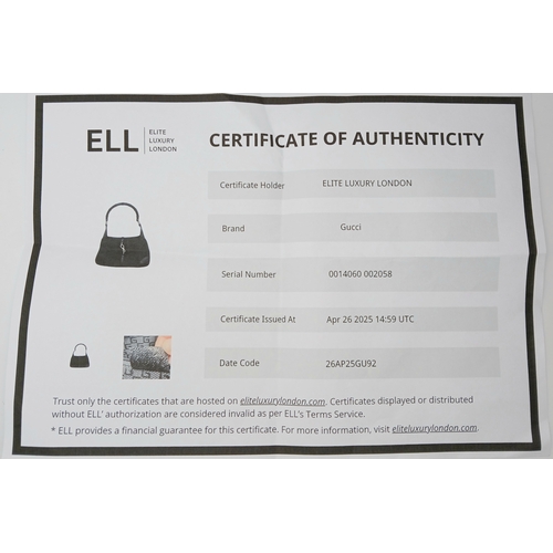 279 - A Gucci Black Canvas and Leather Bamboo-Top Handle Handbag. Black canvas exterior with bamboo-style ... 