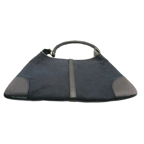 279 - A Gucci Black Canvas and Leather Bamboo-Top Handle Handbag. Black canvas exterior with bamboo-style ... 