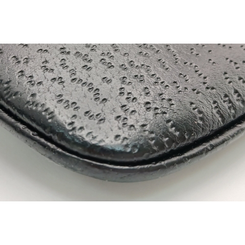 279 - A Gucci Black Canvas and Leather Bamboo-Top Handle Handbag. Black canvas exterior with bamboo-style ... 