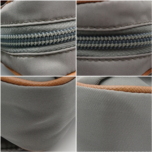 293 - A Prada Grey Nylon and Leather Trim Belt Bag. Grey nylon exterior with tan leather trim, silver-tone... 