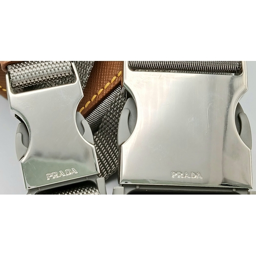 293 - A Prada Grey Nylon and Leather Trim Belt Bag. Grey nylon exterior with tan leather trim, silver-tone... 