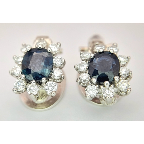 297 - A Pair of 14K Gold, Diamond and Sapphire Earrings. 2 x 1ct oval cut sapphires 2 x 10 round brilliant... 