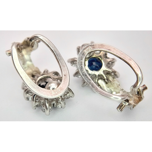297 - A Pair of 14K Gold, Diamond and Sapphire Earrings. 2 x 1ct oval cut sapphires 2 x 10 round brilliant... 