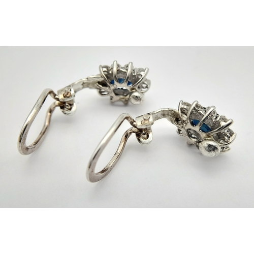 297 - A Pair of 14K Gold, Diamond and Sapphire Earrings. 2 x 1ct oval cut sapphires 2 x 10 round brilliant... 