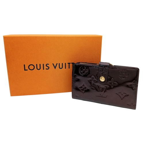 313 - A Louis Vuitton Vernis Amarante Monogram Purse. Dark burgundy patent leather exterior with gold-tone... 
