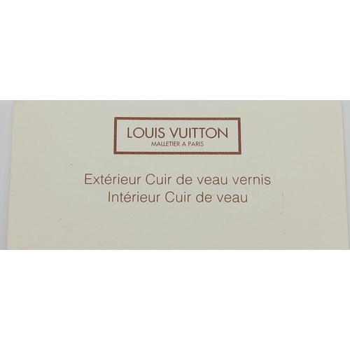313 - A Louis Vuitton Vernis Amarante Monogram Purse. Dark burgundy patent leather exterior with gold-tone... 