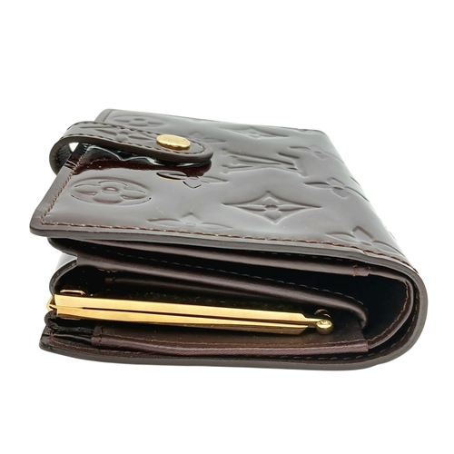313 - A Louis Vuitton Vernis Amarante Monogram Purse. Dark burgundy patent leather exterior with gold-tone... 