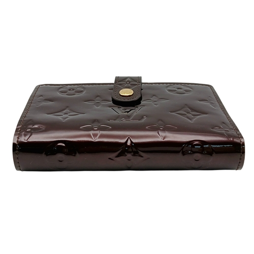 313 - A Louis Vuitton Vernis Amarante Monogram Purse. Dark burgundy patent leather exterior with gold-tone... 