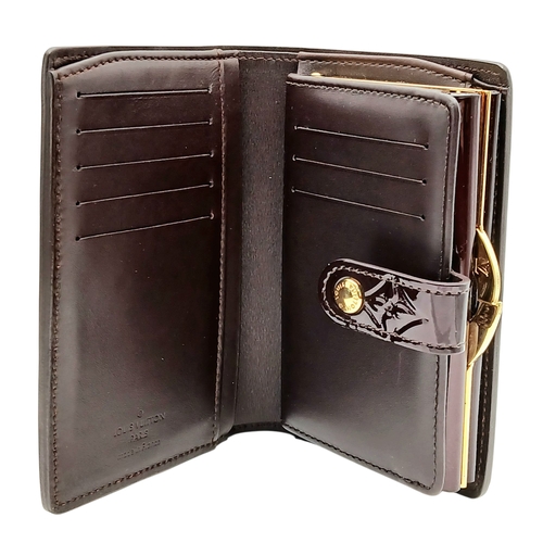 313 - A Louis Vuitton Vernis Amarante Monogram Purse. Dark burgundy patent leather exterior with gold-tone... 