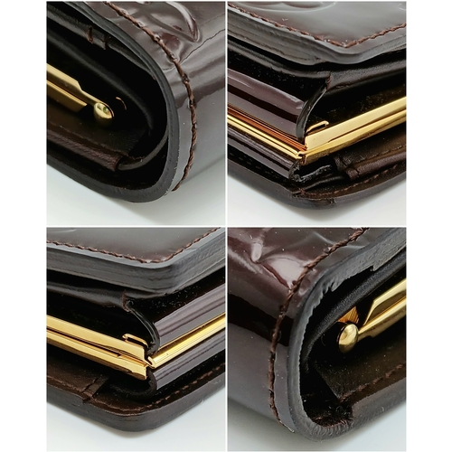 313 - A Louis Vuitton Vernis Amarante Monogram Purse. Dark burgundy patent leather exterior with gold-tone... 