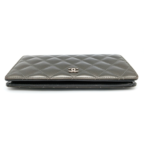 327 - A Chanel Metallic Silver Quilted Patent Leather Wallet. Metallic silver leather exterior with silver... 