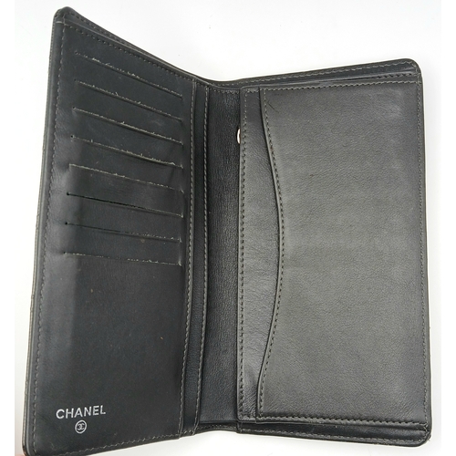 327 - A Chanel Metallic Silver Quilted Patent Leather Wallet. Metallic silver leather exterior with silver... 