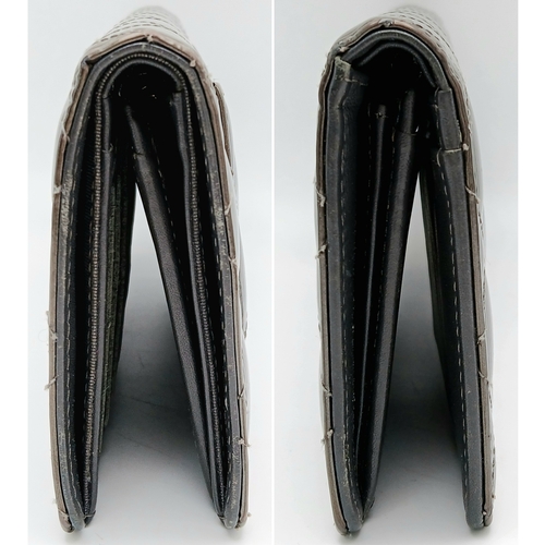 327 - A Chanel Metallic Silver Quilted Patent Leather Wallet. Metallic silver leather exterior with silver... 