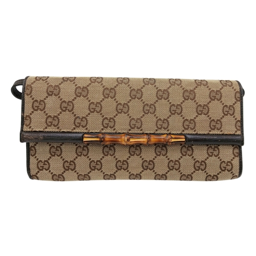 343 - A Gucci Monogram Bamboo Crossbody/Clutch Bag. Canvas exterior with leather trim, silver-toned hardwa... 